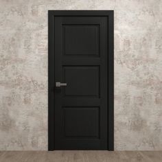 an empty room with a black door on the wall and wood flooring in front of it