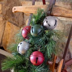 a christmas tree decorated with bells and pine needles