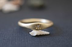 "GOLD DAY =free shipping= Minimalist signet ring for gold lovers. 2mm thick gold ring with a soft oval element set with a beautiful white diamond. This delicate ring is designed to drive attention but without weighing heavily on one. Each piece is finished by hand, distinguishing it from machine-made items. Made with love and care by a jewelry artisan inspired by modern and minimal forms. All my pieces are carefully handmade. Irregularities and imperfection are signs of authenticity. Measures/De Celestial Style Diamond Ring With Single Round Diamond, Celestial Style Round Diamond Ring With Single Diamond, Celestial Diamond Rings Stamped 14k, Celestial Single Diamond Wedding Jewelry, Celestial Wedding Jewelry With Single Diamond, 14k Gold Celestial Diamond Ring, Celestial 14k Gold Diamond Ring, Celestial Round Single Diamond Jewelry, Celestial Style Single Diamond Jewelry