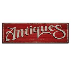 an antique sign with the word antiques written in white ink on a red wooden background