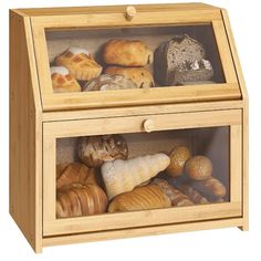 a wooden box filled with lots of different types of bread and pastries in it