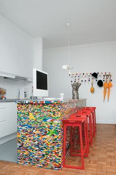 there are many lego stools in this kitchen