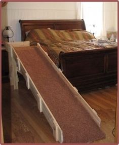 a bed with a wooden slatted headboard and foot board attached to it