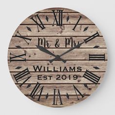 a wooden clock with roman numerals and the words mr and mrs on it