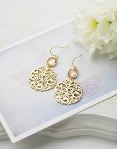 Peach Champagne and Gold Dangle Earrings. Peach Wedding Jewelry. Bridesmaid Earrings. These sweet earrings feature sparkly peach glass squares with beautifully textured filigree pendants dangling below.The peach stones can be changed to a different color upon your request.♥Measurement and details:Total length: approx. 1.8" (47mm)Peach glass stone: 8mmEar Wires: gold plated over brass, High quality plated. Anti tarnish♥ For more beautiful earrings:www.etsy.com/shop/KiraKiraDesign?ref=search_shop_ Elegant Gold Earrings For Bridesmaids, Nickel-free Round Chandelier Earrings For Wedding, Elegant Peach Wedding Earrings, Elegant Peach Earrings For Wedding, Filigree Dangle Teardrop Earrings For Wedding, Filigree Teardrop Dangle Earrings For Wedding, Elegant Pink Nickel-free Chandelier Earrings, Elegant Nickel-free Pink Chandelier Earrings, Elegant Peach Dangle Earrings