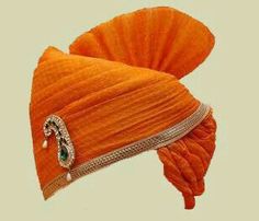 an orange turban with jewels on it