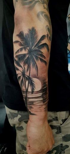 a man with a palm tree tattoo on his arm