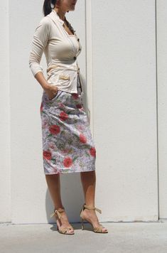 "ArtAffect signature, High Waist Skirt is created with attention to details Fit is figure flattering with 4\" wide waist band This beautiful pencil skirt is made of medium weighted fabric with hint of stretch for easy move It has beige and gray undertone background with toned down orange, green and white flower pattern Classic pencil skirt length makes it to dress up for special occasion Figure flattering fit for work- ready look and even more -Long and lean silhouette -Tailored Fit -Drops below Fitted Gathered Skirt Bottoms For Garden Party, Multicolor Floral Print Pencil Skirt, Fitted Gathered Skirt For Garden Party, Multicolor Floral Pencil Skirt, Casual Floral Print Pencil Skirt, Casual Pencil Skirt With Floral Print, Spring Cotton Pencil Skirt With Lining, Casual Cotton Skirt For Garden Party, Spring Cotton Lined Pencil Skirt