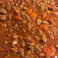 a large pot filled with meat and vegetables