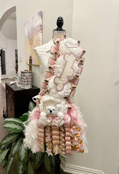 a dress made out of pink and white feathers