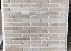 a white brick wall with no mortar or mortars on the top and bottom part