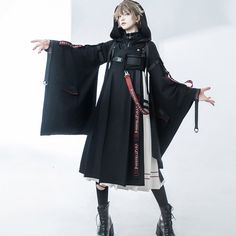 A hooded cardigan, sweatshirt, and jumper skirt that will make you look like a magician who has sacrificed himself to magic. The hooded cardigan has a loose silhouette that resembles a jacket. The sweatshirt has a high neck design and a buckle is decorated at the neck. The jumper skirt is designed with pleats on a white background, and the back is decorated with lace-up. A magician who gathers magical power to create miracles. Let yourself be invited to a world of fantasy. 
 
 
 Delivery schedul Witchy Long Sleeve Costume Outerwear, Witchy Long Sleeve Outerwear For Costume, Gothic Hoodie For Halloween Cosplay, Witchy Long Sleeve Winter Outerwear, Witchy Hooded Outerwear For Cosplay, Gothic Hooded Hoodie For Cosplay, Witchy Hooded Winter Outerwear, Skirt Jumper, High Neck Designs