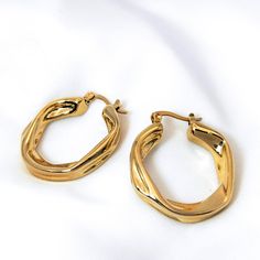 Hoop Earrings These earrings are crafted from high-quality stainless steel and plated with 24K gold, offering both durability and elegance.  The waterproof feature means you can wear them without worrying about damage from moisture. Metal: Stainless Steel 24k Gold Plated Cubic Zirconia Length: 3.1cm / 1.22inch Weight: 18g Waterproof & Sweatproof Hypoallergenic, Nickel-free & Lead-free Stainless Steel Yellow Gold Hoop Earrings Gift, Stainless Steel Tarnish Resistant Huggie Earrings For Gifts, Gift Stainless Steel Tarnish Resistant Huggie Earrings, Yellow Gold Small Hoop Earrings In Stainless Steel, Yellow Gold Stainless Steel Small Hoop Earrings, Hypoallergenic Gold Stainless Steel Hoop Earrings, Tarnish Resistant Small Hoop Huggie Earrings In Stainless Steel, Tarnish Resistant Stainless Steel Small Hoop Huggie Earrings, Tarnish Resistant Stainless Steel Huggie Earrings