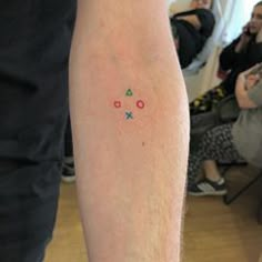 a person with a small tattoo on their arm