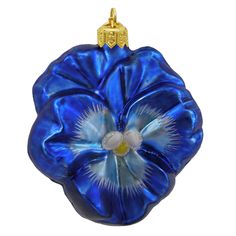 a blue glass flower ornament hanging from a chain