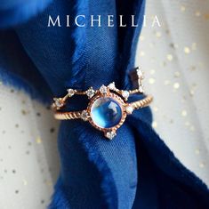 "Our current turnaround time for regular orders is 6-8 weeks. For urgent orders, please shop our Ready-to-Ship collection below (7-10 business days): https://michellia.com/collections/ready-to-ship (please copy and paste into browser) -------- 「Stella」- Aura of Galaxy Ring, in Moonstone Traveled through moons and stars, our galaxy-inspired \"Stella\" is designed to remind us of the infinite possibilities in our incredible universe. The focal iridescent gem is surrounded by four pieces of genuine Dipper Constellation, Moon Of My Life, Opal Australia, Galaxy Wedding, Galaxy Necklace, Galaxy Ring, Unique Bands, Moonstone Engagement, Moonstone Engagement Ring