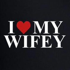 i love my wife sticker on the back of a black shirt with red heart