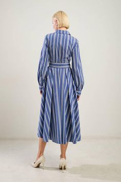 Long sleeves, striped, midi shirt dress with self belt. Available in blue/white/gold. 65% Cotton, 32% Nylon, 3% Spandex US Size (Bust - Waist - Hips) Small 2-4 (34 - 26 -36) Medium 6 (36 - 28 -38) Large 8-10 (38 - 30 -40) Shirt Midi Dress, Outerwear Trends, Flying Tomato, Affordable Dresses, Midi Shirt Dress, Vintage Inspired Design, Swimsuit Cover, Sweatshirt Dress, Baby Month By Month