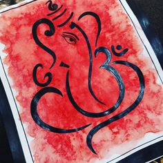 an elephant is painted on a red and black piece of paper that says ganesh