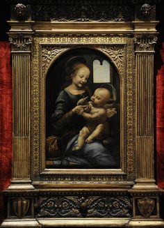 an ornate painting with a baby in it's lap next to a red curtain