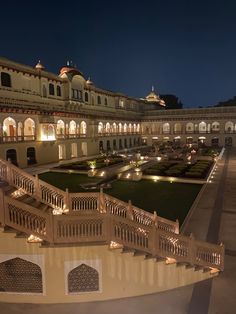 a large building with many balconies lit up at night