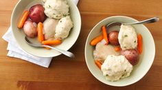 two bowls filled with mashed potatoes and carrots on top of a wooden table