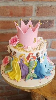 there is a cake with princesses on it