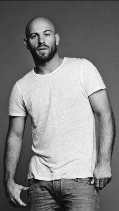 black and white photograph of a man in a t - shirt