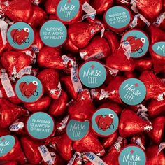 many heart shaped candies are shown in red and blue foil with the words nurse life on them