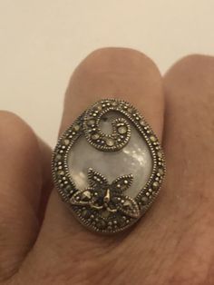 Vintage hand made about an in long Mother of Pearl set in 925 Sterling Silver Marcasite ring I have size 5.5 Can be re sized for you, my jeweler would charge $10 All rings are shipped in a nice gift box. Check out our over a THOUSAND great reviews Engraving is $4 per letter and is not always perfect depending on the piece. It can take a few days if the jeweler is busy. This is payable to Paypal Judithsltd@gmail.com Marcasite Ring, Sterling Silver Marcasite, Pearl Set, Red Garnet, 925 Sterling Silver Ring, Vintage Rings, Mother Of Pearl, My Jewellery, Statement Rings