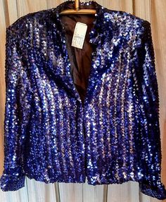 This is a very nice deep blue/lavender sequined jacket with an Asian flare.  Has a Mandarin collar, sequined cuffs.  Has a large hook and eye closure.  It's in excellent condition.  Armpit to armpit is 19 inches.  Sale is final. Sequin Jacket, Beautiful Sweater, The Prestige, Mandarin Collar, Jackets & Coats, Jackets For Women, Collar, Bathing Beauties, Clothes For Women