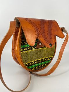 This Purse/bag is made in Kenya using locally available materials. Leather bag has been used by many African tribes in different shapes and sizes. Young entrepreneurs have found a way to make the same item with a particular appeal to their peers across the oceans. The result is this beautiful piece of art that is carefully hand-crafted into crossbody purse. Hand-stitched Crossbody Shoulder Bag For Daily Use, Hand-stitched Crossbody Shoulder Bag, Daily Use Hand-stitched Crossbody Shoulder Bag, Traditional Pouch Satchel For Daily Use, Traditional Pouch Satchel For Everyday Use, Handmade Satchel Saddle Bag For Daily Use, Traditional Shoulder Bag Satchel For Everyday Use, Traditional Satchel With Adjustable Strap For Daily Use, Handmade Saddle Bag Satchel For Daily Use