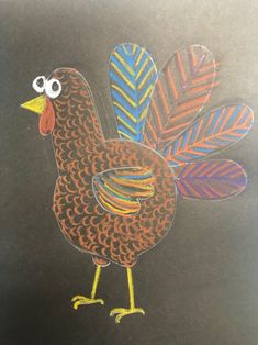 a drawing of a chicken with colored feathers on it's head and eyes drawn in chalk