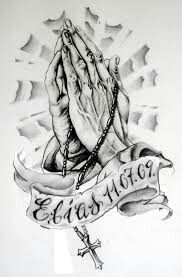 a black and white drawing of a praying hands with a banner around it that says,