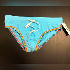 Sexy Robins Egg Blue Brief W Pride Piping, Drawstring Closure, Front Lined. 83% Nylon 17% Spandex. Blue Sporty Nylon Swimwear, Sporty Blue Nylon Swimwear, Sporty Light Blue Swimwear For Swimming, Casual Light Blue Stretch Swimwear, Sporty Light Blue Swimwear For Active Use, Sporty Light Blue Swimwear For Sports, Tie Swimsuit, Swim Brief, Robins Egg