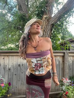 This is a one of a kind  Zasra design. This listing is for the eco  made, tube top. For this one of a kind eco tube top, I chose a patchwork mix of cottons, in a pretty hippy floral mix. The  color mix is curry, tan, toffee, cream, turquoise,maroon, cherry, purple, orange, lime, copper, mustard. Added extra upcycled, Rolling Stones  appliqué.  The one of a kind necklace, earrings,  I made too, and are available in my shop.   Size XS/S  model wears a 4/6 5'4 and is a 36" B fit at max Length~ 12" Bohemian Bandeau Tops For Summer, Fitted Bohemian Tube Top For Festivals, Summer Festival Patchwork Tops, Summer Patchwork Crop Top, Funky Multicolor Tops For Festival, Hippie Crop Top For Music Festival, Hippie Cotton Crop Top For Festivals, Hippie Patchwork Tops For Festival, Hippie Fitted Patchwork Tops