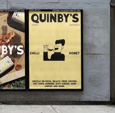 an advertisement for quibbly's pizza on the side of a building in new york city