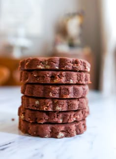 a stack of cookies sitting on top of a white counter