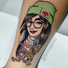 a woman with glasses and a hat on her leg is shown in this tattoo design