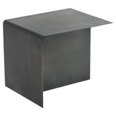 a square metal table with one end missing