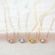 "The Evil Eye is a popular amulet symbolizing a protection against bad luck. - available in WHITE & MINT Opal in gold, silver and rose gold finish. The evil eye is also referred to as the \"lucky eye.\" Keep the evil eye closed to you to bring you luck and ward off negativity! D E T A I L S - Classic & Timeless Dainty Opal Evil Eye - Eye size : 12mm x 6mm (1/2\" x 1/4\") - White Opal or Mint Opal of your choice (white opal is not pure white, it's closer to 'bluish white') - Each piece or Spiritual Pendant Jewelry For Birthday Gift, Spiritual Pendant Charm Necklace For Birthday, Adjustable Spiritual Necklaces As Birthday Gift, Adjustable Spiritual Necklace For Birthday Gift, Spiritual Nickel-free Necklace For Gifts, Spiritual Birthstone Necklace For Birthday Gift, Personalized Amulet Necklaces For Gifts, Symbolic Personalized Good Luck Necklaces, Symbolic May Birthstone Jewelry As Gift