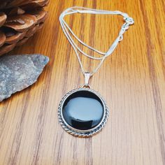 "Visit our on-line shop at: Etsy.com/shop/925ForHer *sterling silver necklace pendant *pendant with silver chain necklace 18\" *southwestern jewelry *black onyx / black stone *calibrate pre-cut stone: about 23mm round shape *classic bezel settings *all jewelry items are made to ship, slight variations in stones will occur comparing to pictures *size of a penny is 19mm or a dime is 18mm in diameter for comparing size with jewelry items *handcrafted in USA *free convenient gift box *free shipping Black Necklace With Box Chain And Round Pendant, Black Necklace With Silver Chain For Gift, Black Sterling Silver Box Chain Jewelry, Black Sterling Silver Jewelry With Box Chain, Black Jewelry With Silver Chain And Round Pendant, Black Necklace With Silver Chain And Round Pendant, Black Sterling Silver Round Necklace, Everyday Earrings Studs, Types Of Gems