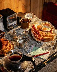 a table topped with lots of breakfast foods