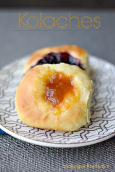 two jelly filled pastries on a plate with the words kolachees above them