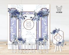 a wedding card with blue flowers on the front and back, surrounded by white folding chairs