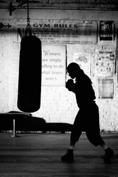 black and white photograph of a person in a boxing ring