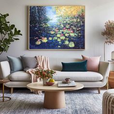 a living room filled with furniture and a painting on the wall above it's coffee table