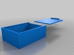 two blue tables sitting next to each other on top of a white table with an open lid