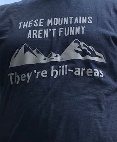 "Fun shirt for the hiker or mountain climber in your life! \"These Mountains Aren't Funny, They're Hill-areas\" with image of mountain. Great gift!" Sporty Graphic Print Tops For Hiking, Blue Screen Print Tops For Outdoor Activities, Blue Tops With Screen Print For Outdoor Activities, Blue Screen Printed Tops For Outdoor Activities, Sporty Screen Print Tops For Outdoor Activities, Climbing Shirt, Mountain Shirt, Hiking Shirt, Mountain Climbers