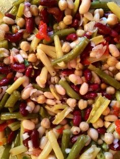 beans and other vegetables are mixed together in a bowl